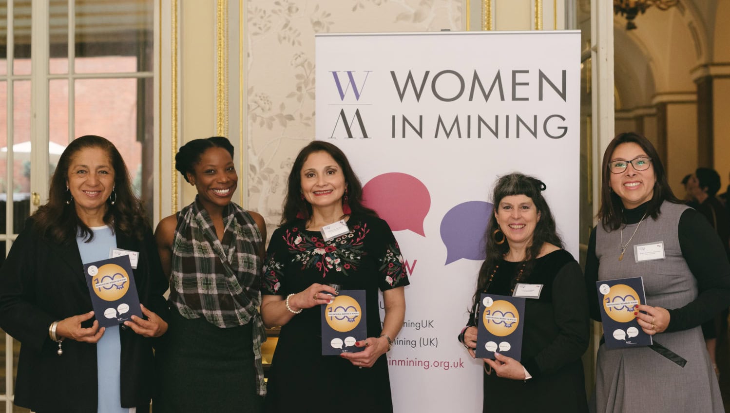 Inspiring the next generation of women in mining 3 Standing together: a few of the 2018 WIM100 pose with the print publication. Photo: Charlotte Knee Photography