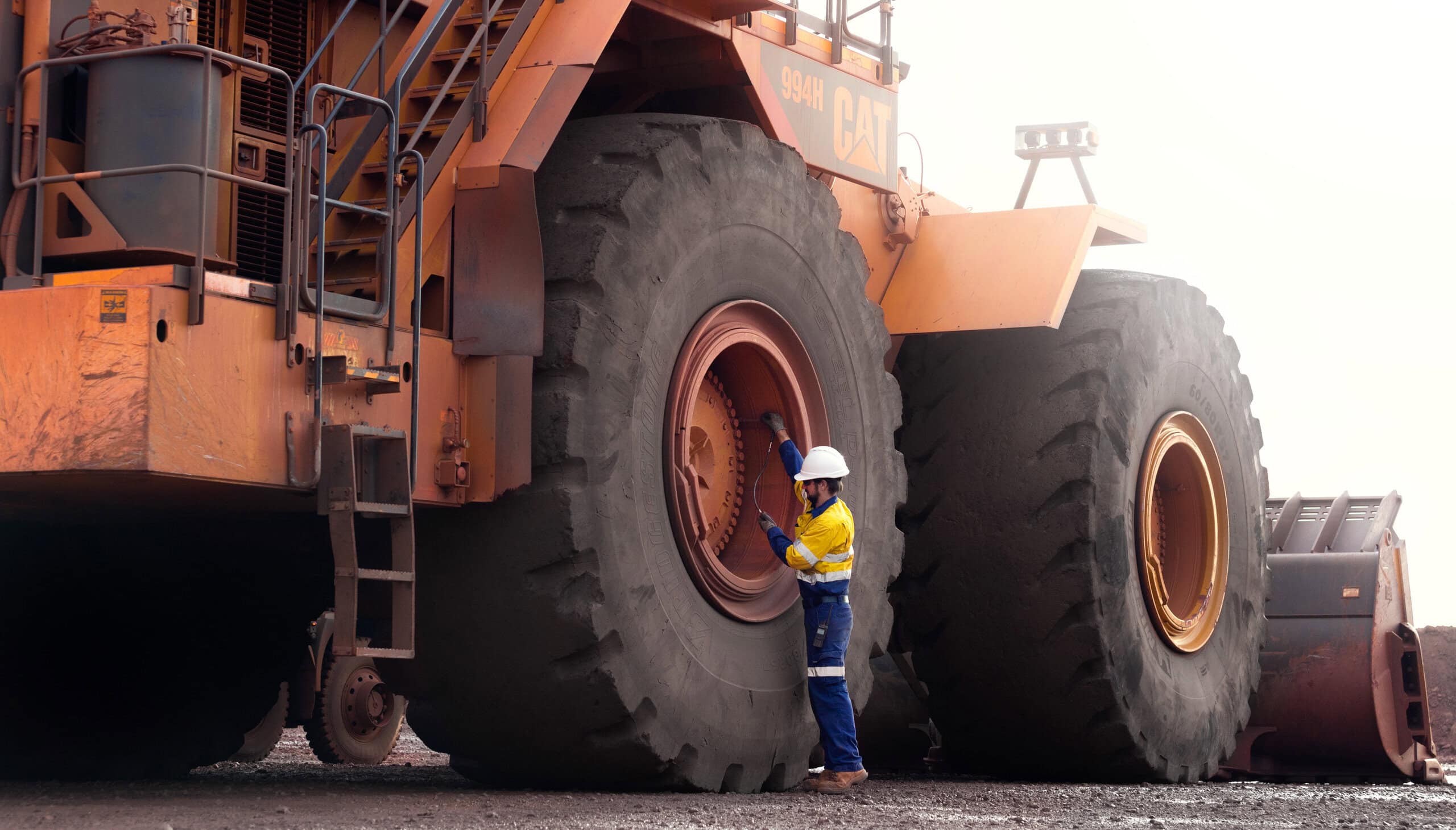 Taking mining tyre management to the next level 5 A Kal Tire technician performs a tyre inspection on a CAT 994 wheel loader. Image: Kal Tire
